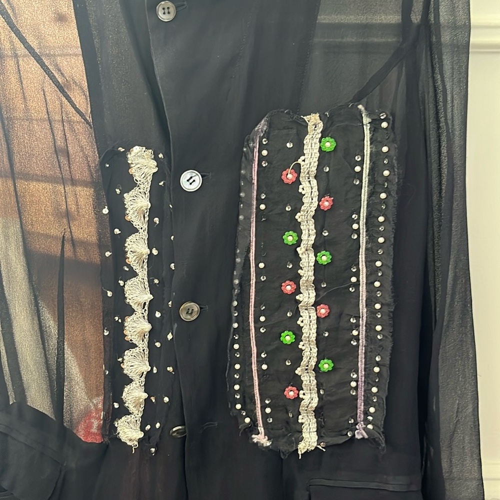 The enchanting blue see-through jacket by Comme Des Garçons